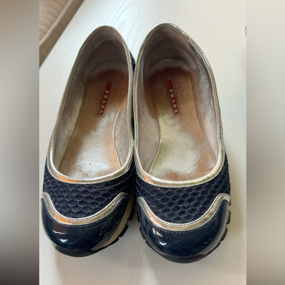 Prada slip ons walking shoes. Very comfy, has a great grip. Some scuffs, shown